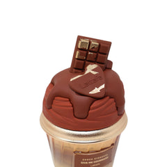 Lattafa Choco Overdose caramel-swatch closeup suggesting creamy vanilla caramel base