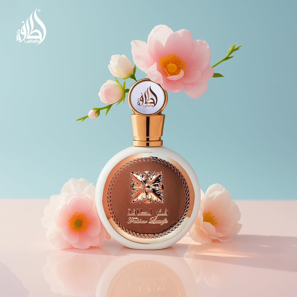 Lattafa Fakhar bottle with flowers, hints at fruity floral heart.