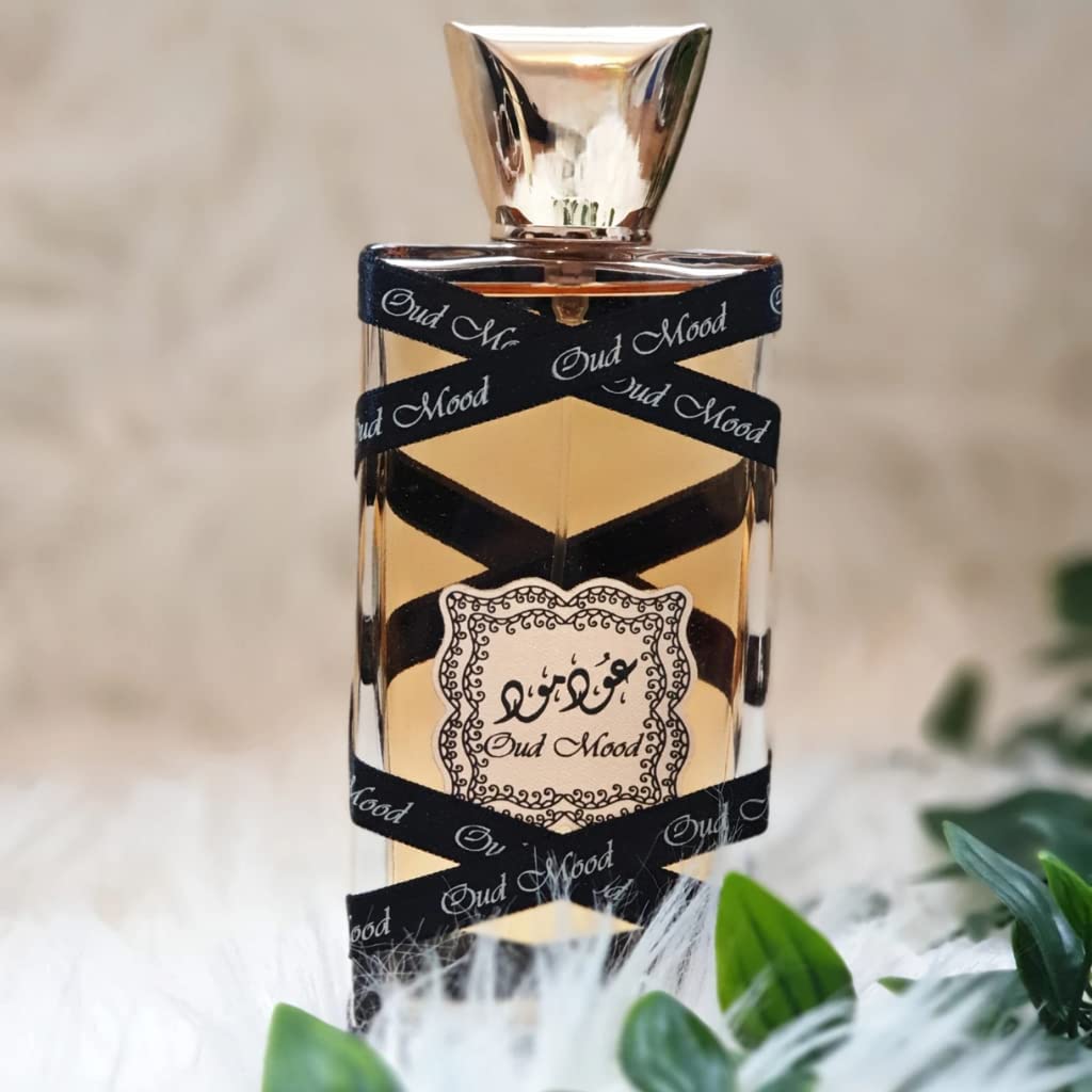 Lattafa Oud Mood bottle closeup highlights elegant cap and premium glass.