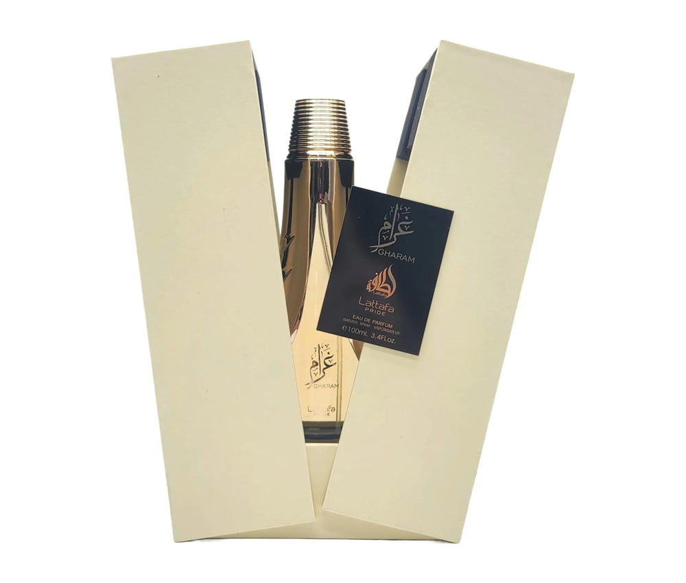 Lattafa Pride Gharam perfume liquid swirl; long-lasting fragrance with amber, sandalwood and praline.