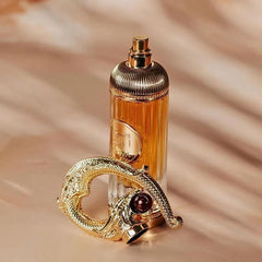 Lattafa Sehr spice image hints cinnamon and almond warmth for cozy mornings.