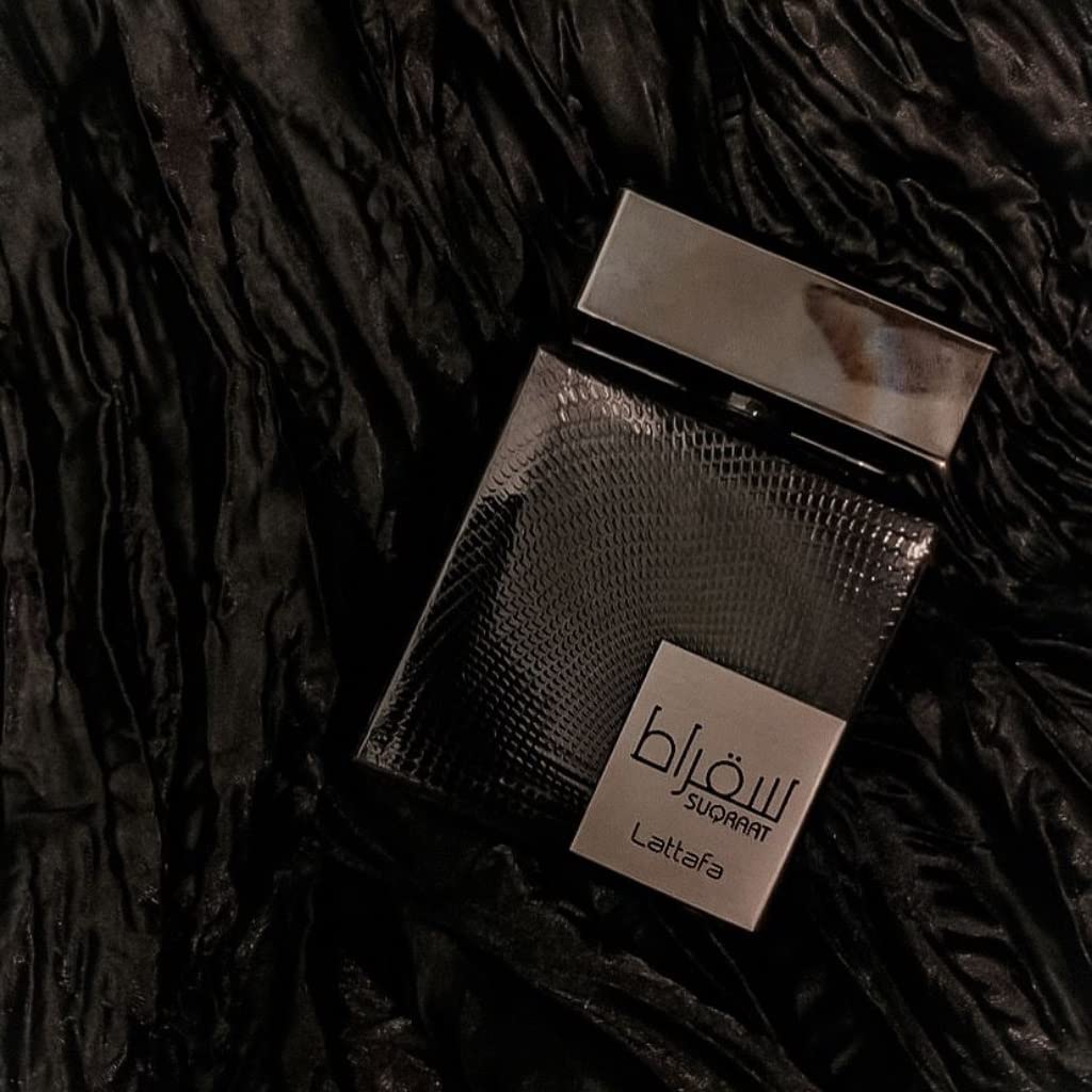 Lattafa Suqraat bottle on dresser showcases premium packaging for gifting.