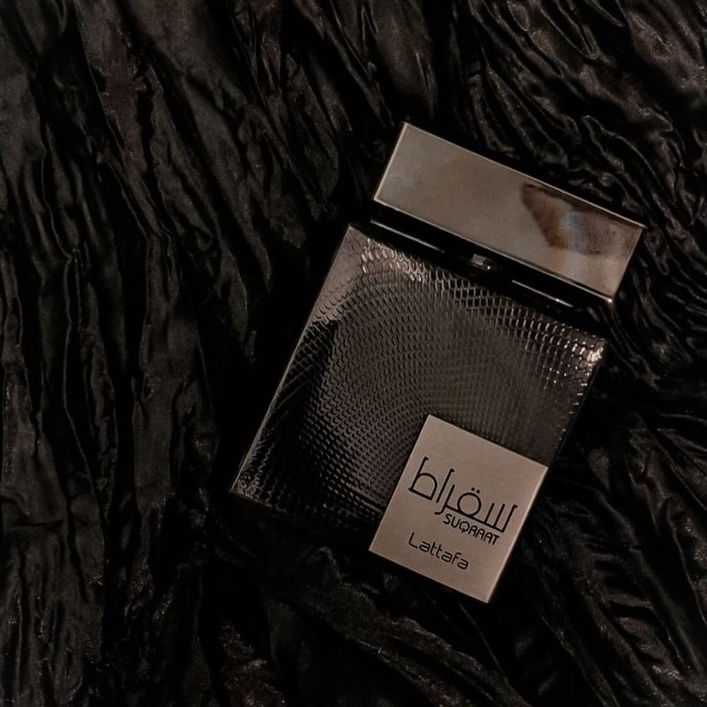 Lattafa Suqraat bottle on dresser showcases premium packaging for gifting.