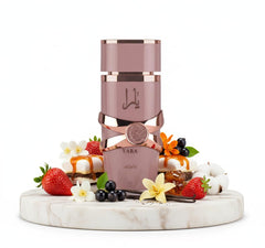 Lattafa Yara Elixir perfume being poured shows its smooth liquid texture.