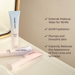 Laura Mercier Pure Canvas Primer being applied on the face for a smooth base.
