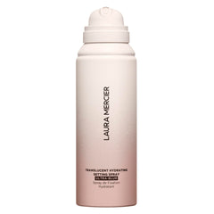 Laura Mercier translucent hydrating setting spray bottle provides 24-hour hydration and a natural finish.