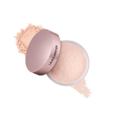 Laura Mercier translucent loose setting powder jar for long-wear, soft matte finish.