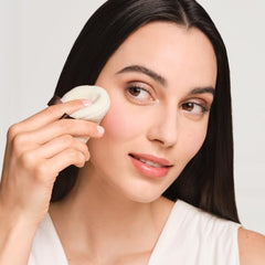 Laura Mercier Velour Puff holding powder for controlled, buildable coverage