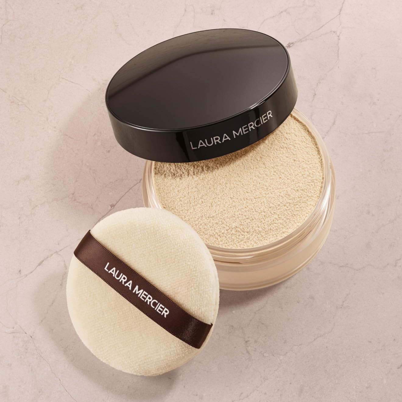 Laura Mercier Velour Puff packaging highlights travel-friendly design