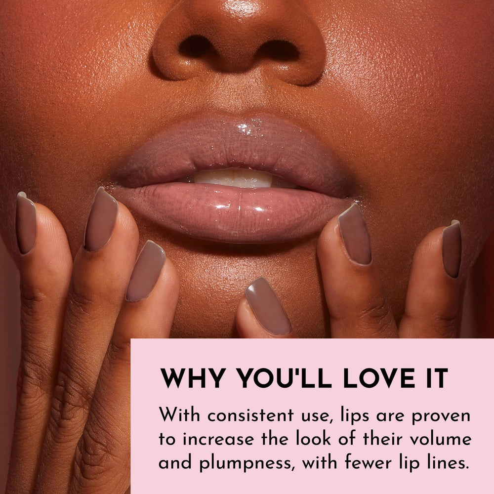 Lawless Forget The Filler Lip Plumper Nudie Pink on lips with visible plump and gloss.