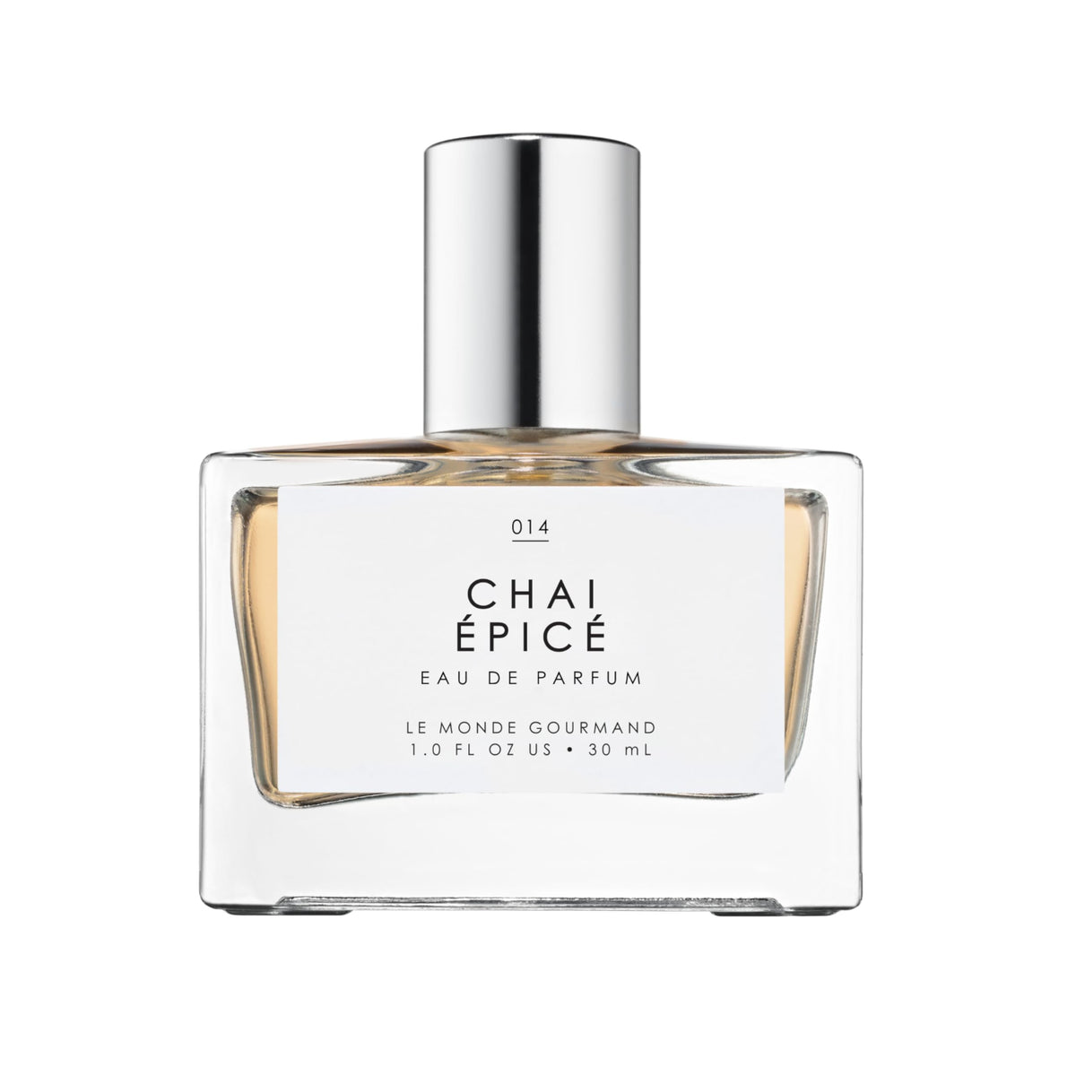 Le Monde Gourmand Chai Épicé spray bottle on wood for a cozy fragrance mood