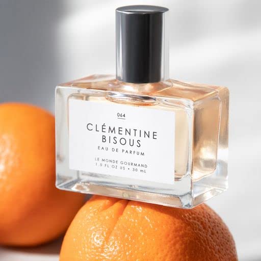 Le Monde Gourmand Clementine Bisous frangipani bloom showcases tropical floral softness.