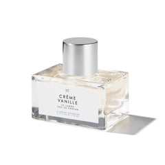 Le Monde Gourmand Crème Vanille EDP bottle on dresser for warm, inviting aroma.