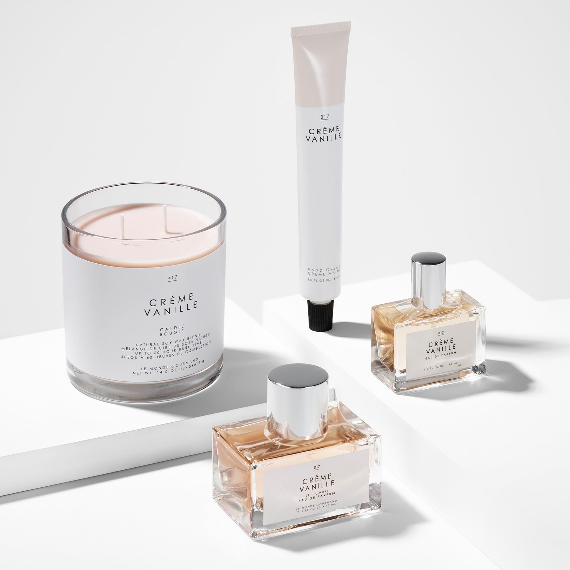 Jasmine petals and creamy vanilla visuals emphasize lush aromatic profile.