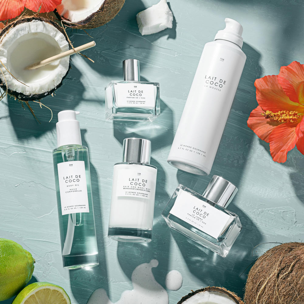 Le Monde Gourmand Lait de Coco mist on a hairbrush for subtle scent styling.