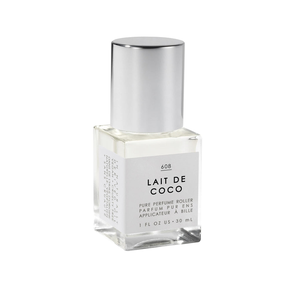 Le Monde Gourmand Lait de Coco perfume oil bottle on vanity shows creamy coconut aroma.