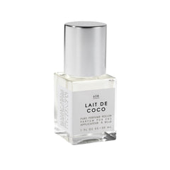 Le Monde Gourmand Lait de Coco perfume oil bottle on vanity shows creamy coconut aroma.