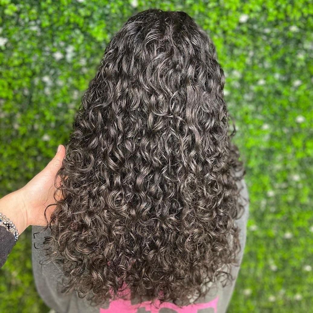 Leaf & Flower Instant Curl Defining Cream texture during application delivering soft definition.