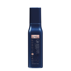 Leaf & Flower Instant Frizz Remedy bottle shows heat-activated frizz control for smooth hair.