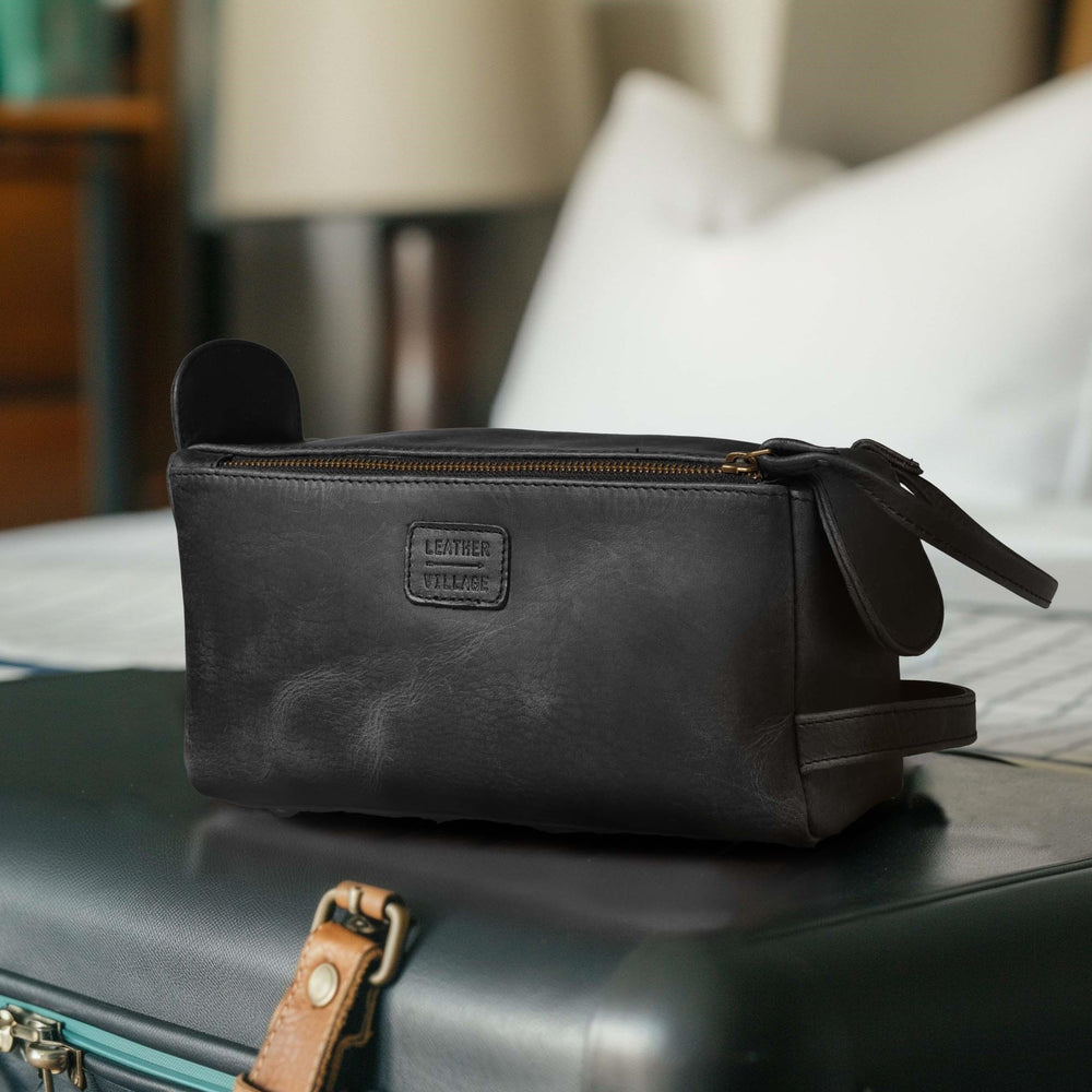 LEATHER VILLAGE premium toiletry bag detailed stitching suggests rugged durability over time