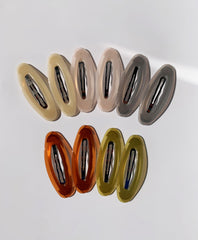 Lemeilleur acrylic resin detail on oval clip adds color and shine.