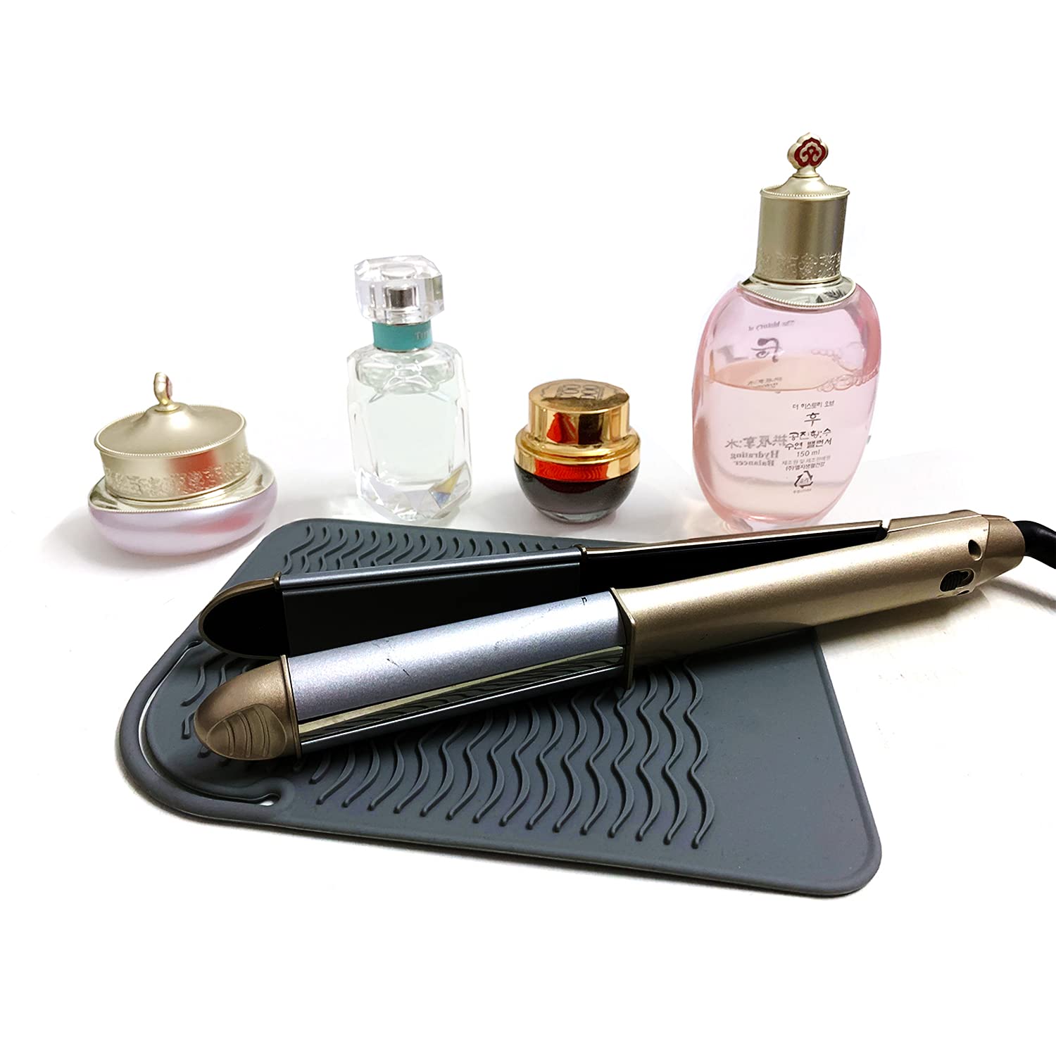 Lessmon mat beside a flat iron for counter protection after use