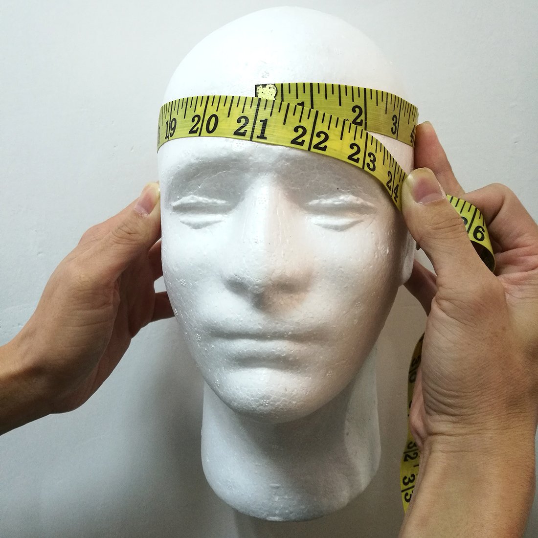 LIAMTU headset display-ready head demonstrates tech accessory merchandising potential.