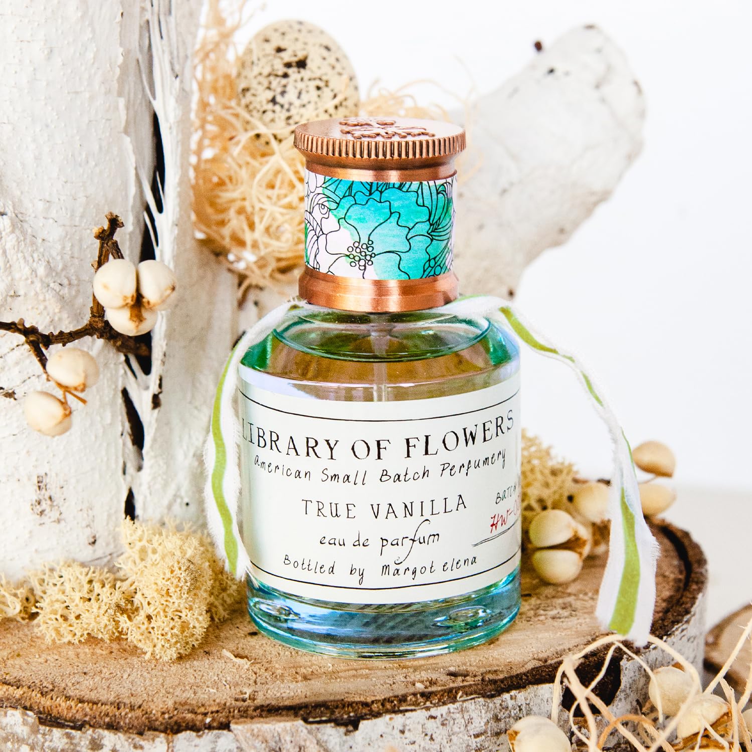 Library of Flowers True Vanilla EDP pulse points spray demonstrates easy application.