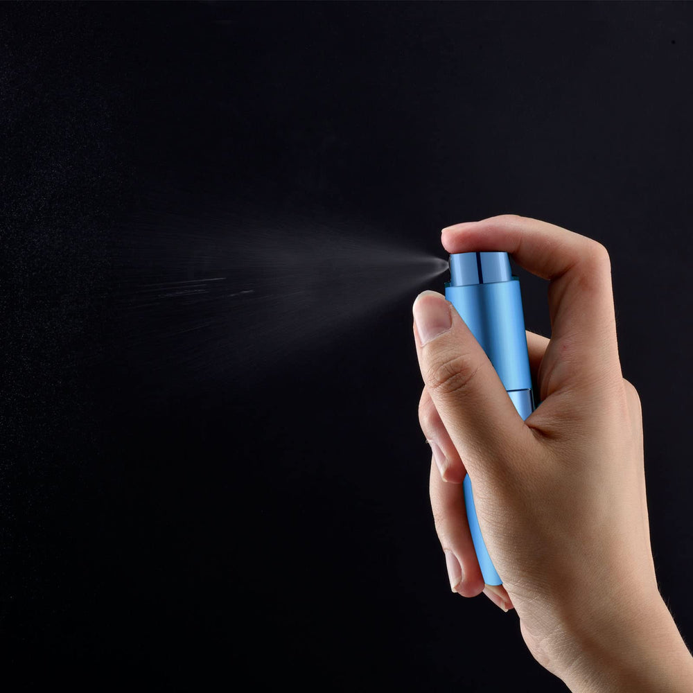 Lil Ray 8ml portable perfume atomizer pink twist lid in use