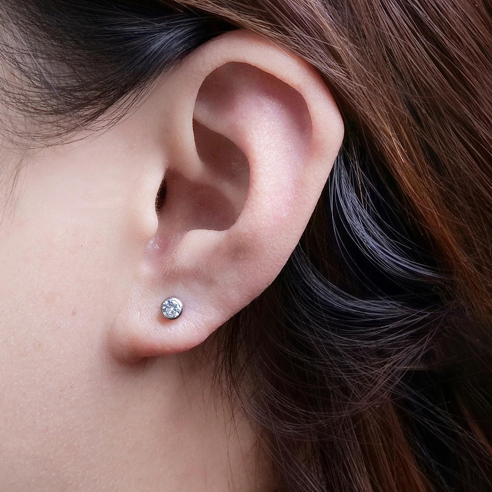 Limerencia ear piercing kit titanium G23 preloaded studs sparkle with 4mm cubic zirconia for stylish wear.