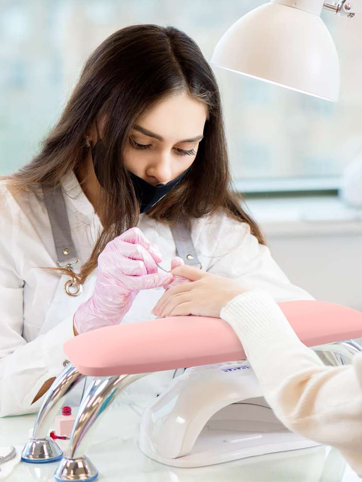 Lionvison arm rest with strong bearing feet secures tools during nail sessions.