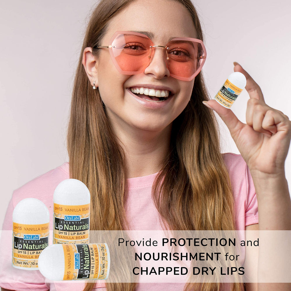 Lip Naturals mini lip balm held in hand for travel-friendly use.