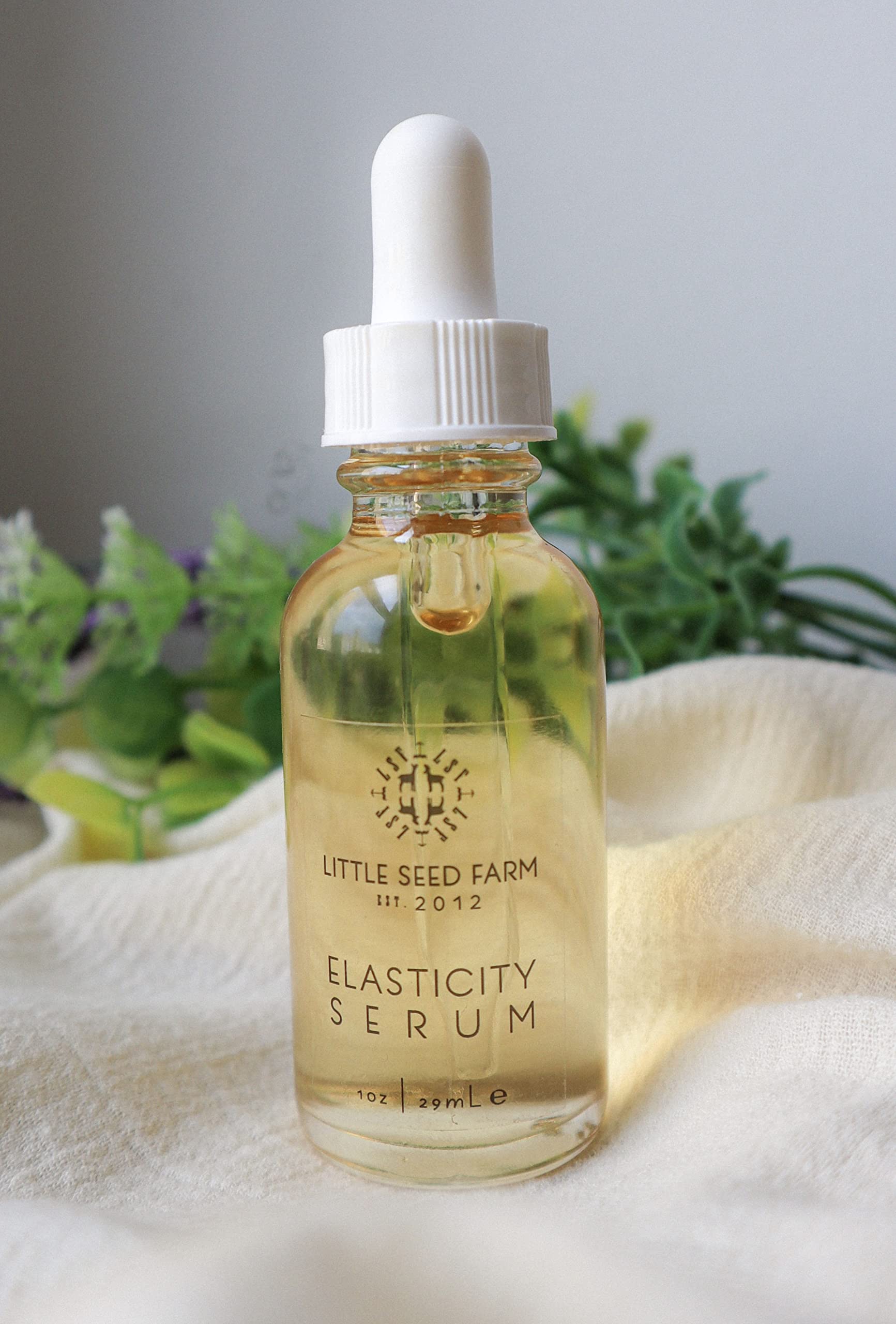 Little Seed Farm Elasticity Serum texture closeup shows light, non-greasy feel.