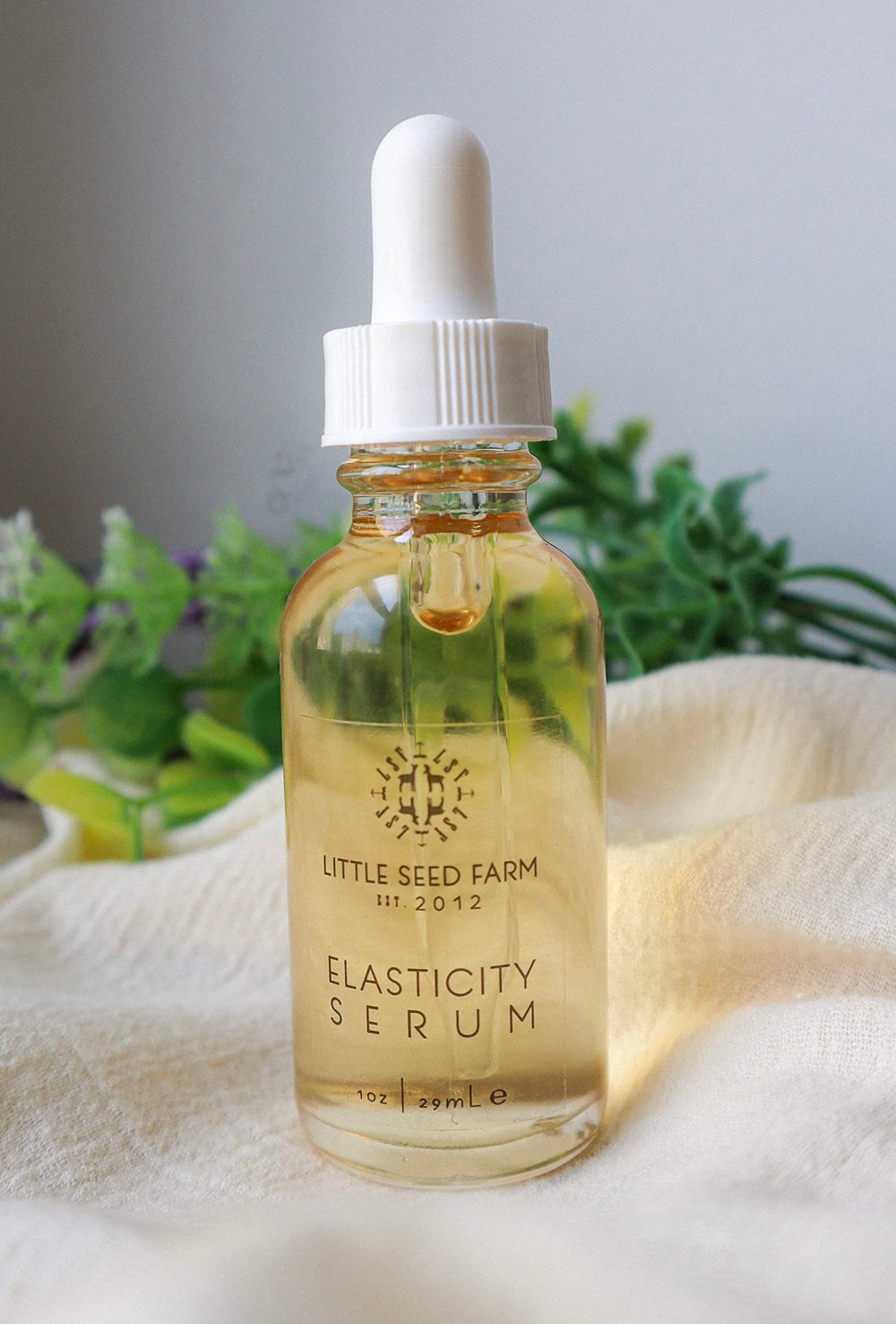 Little Seed Farm Elasticity Serum texture closeup shows light, non-greasy feel.