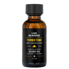 Live Bearded Tombstone scent bottle shows premium jojoba for hydrated beard and skin.