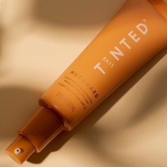 Live Tinted Hueguard mini application on face demonstrates daily hydration and sun protection.