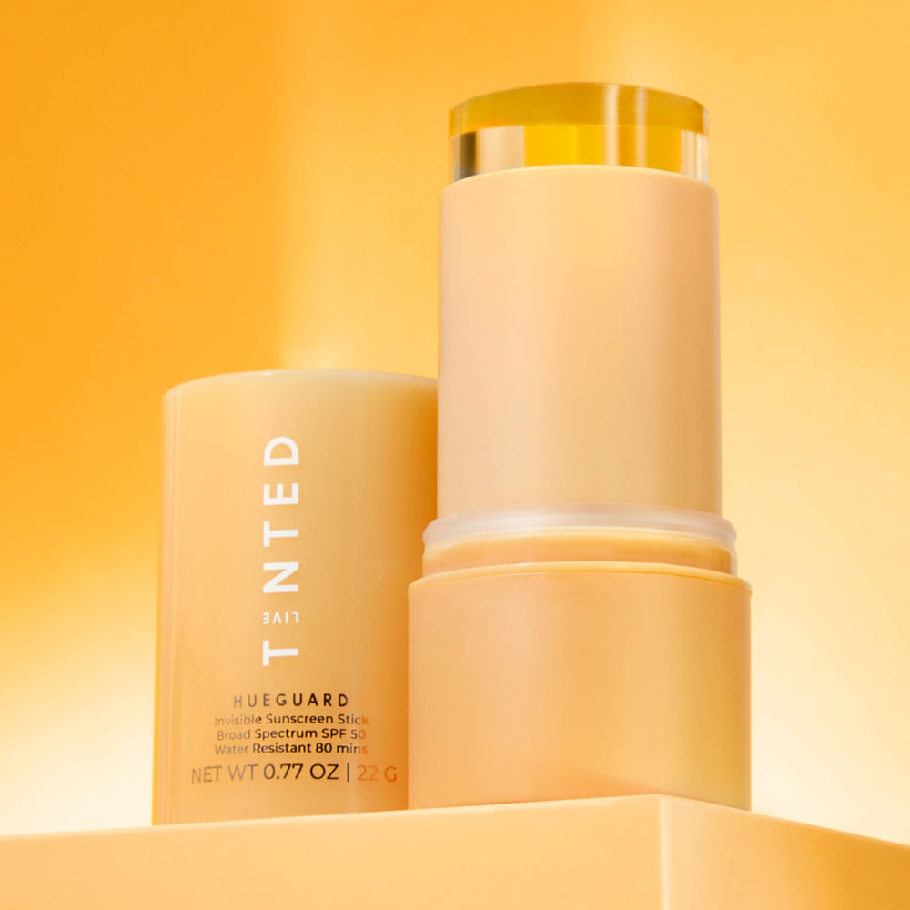 Live Tinted Hueguard with water splash to emphasize sweat and water resistance