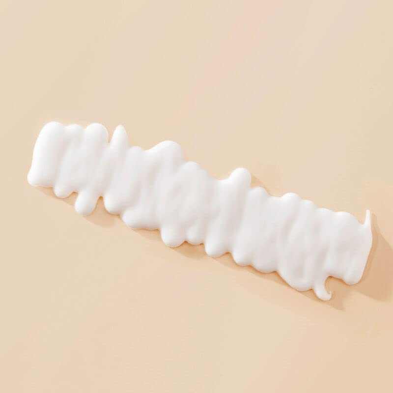 Living Proof Curl Definer finish shot highlighting curl definition and shine.