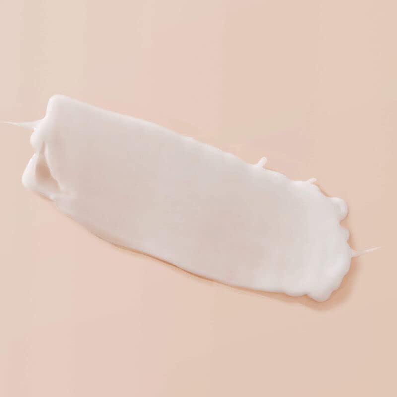 Living Proof Curl Enhancer damp hair styling scene illustrating frizz control