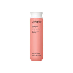 Living Proof Curl Shampoo bottle front showing defined curls after a gentle cleanse