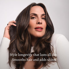 Living Proof Full Thickening Blow-Dry Cream in use on damp hair.