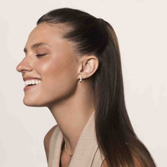 Living Proof No Frizz Smooth Styling Cream dispensing closeup shows creamy root-to-tip conditioning.