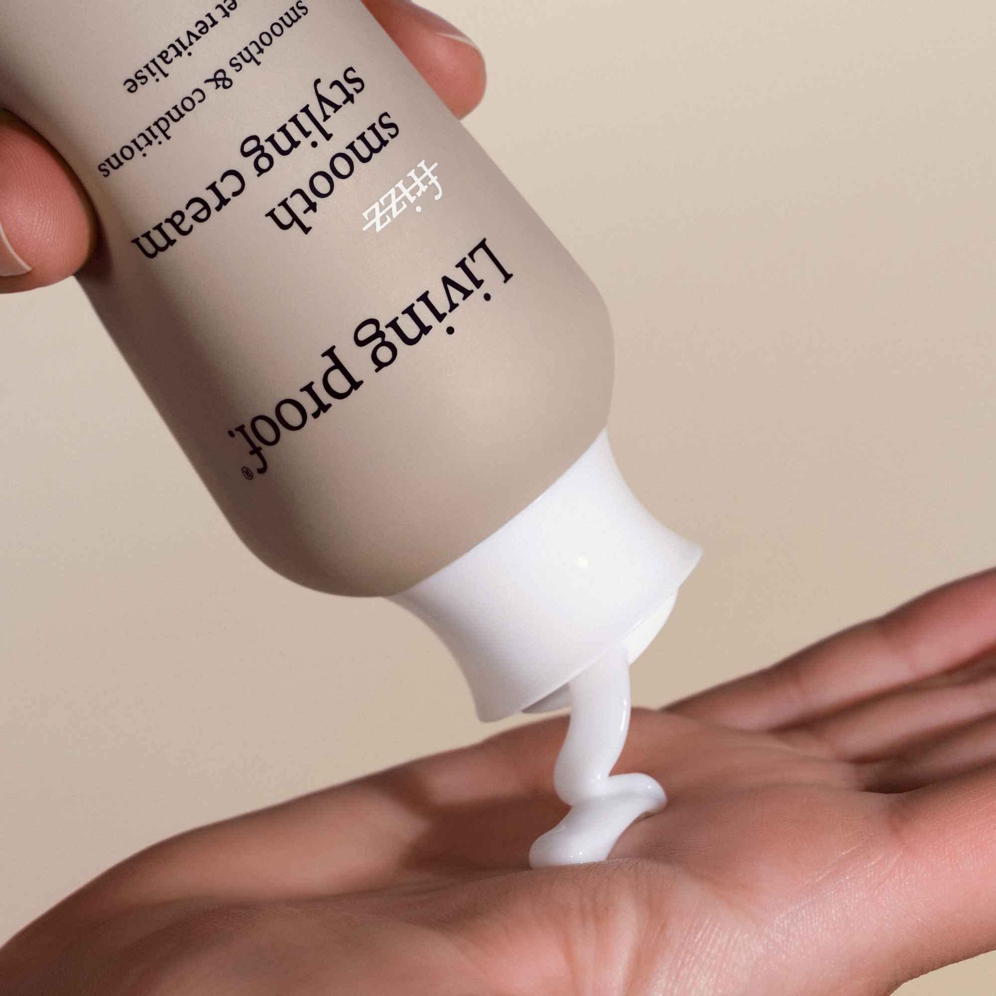 Living Proof No Frizz Smooth Styling Cream application on hair demonstrates even coverage.