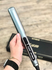 Lizze Extreme titanium plates close-up show smooth glide through thick hair.