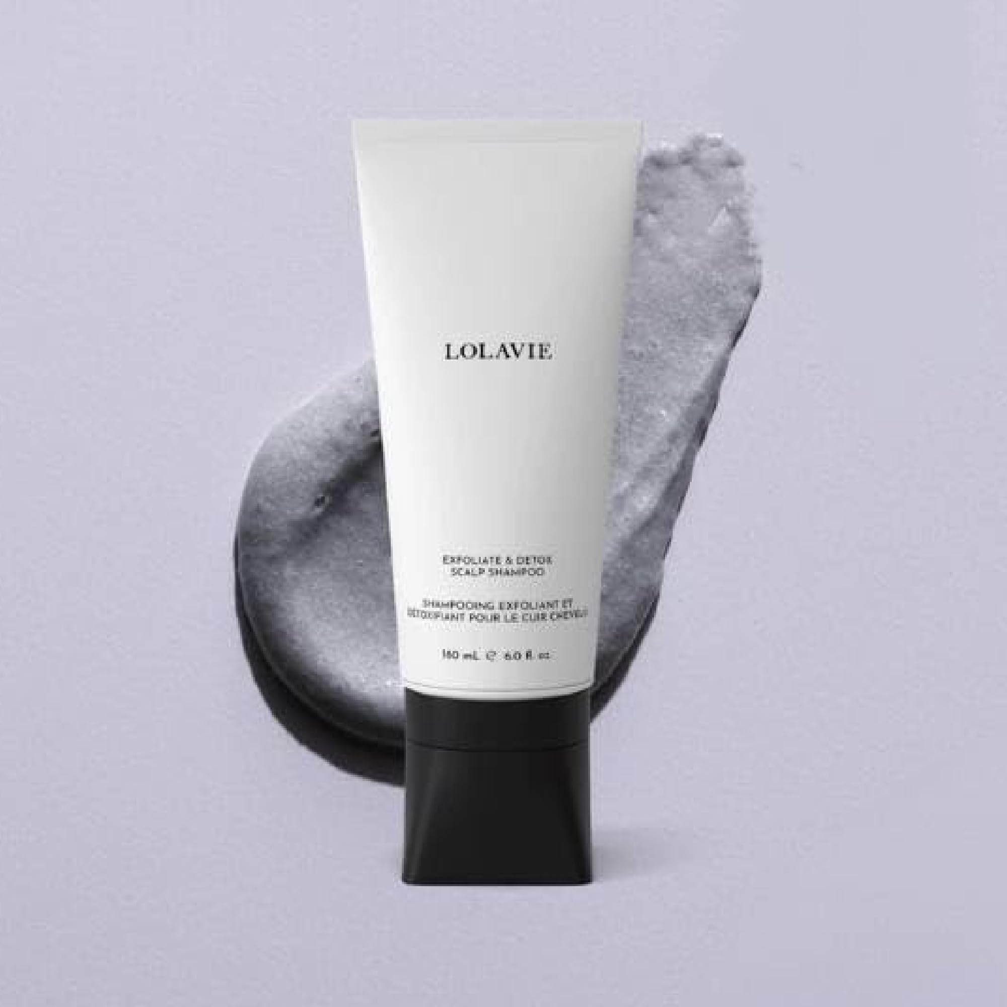 LolaVie Exfoliate & Detox Scrub bottle pump closeup highlights impurity removal.