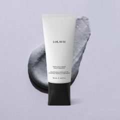 LolaVie Exfoliate & Detox Scrub bottle pump closeup highlights impurity removal.