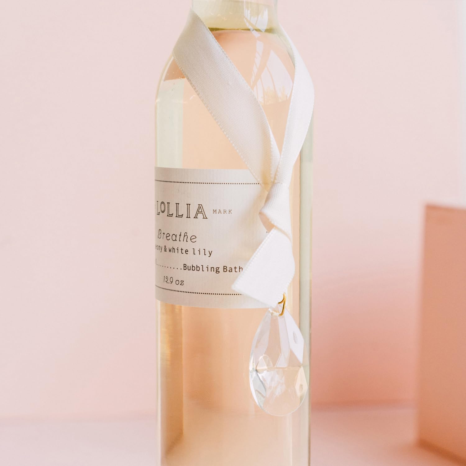 Lollia Breathe crystal accent and satin packaging elevate bath time aesthetics