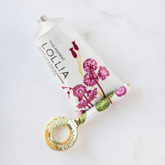 LOLLIA key attached to hand cream tube demonstrating easy winding benefit