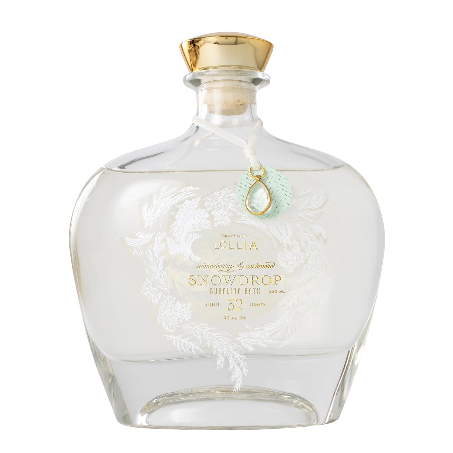 LOLLIA Snowdrop bubble bath bottle showcases frosted glass with gold accents for an elegant spa look.