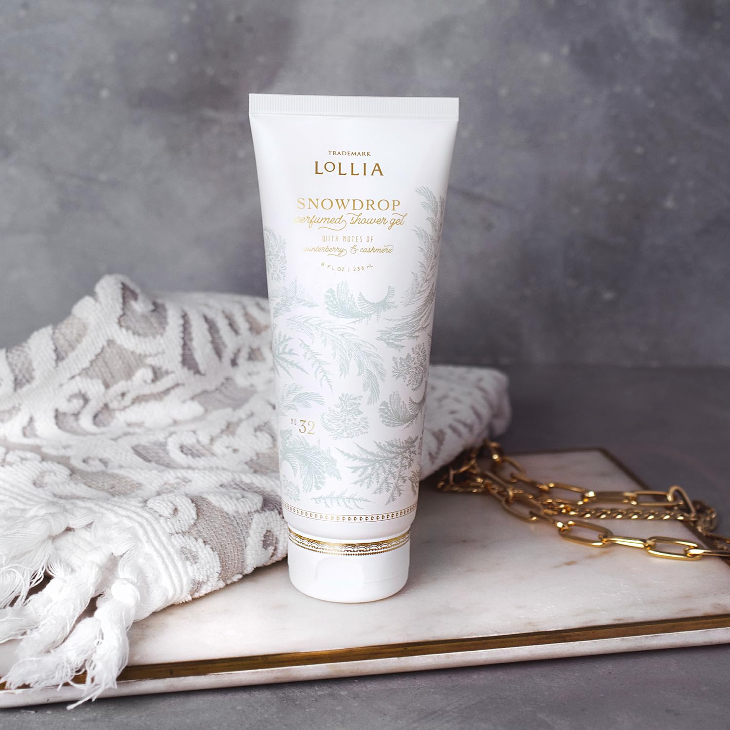 LOLLIA Snowdrop Shower Gel packaging with gold detailing adds elegant bathroom decor